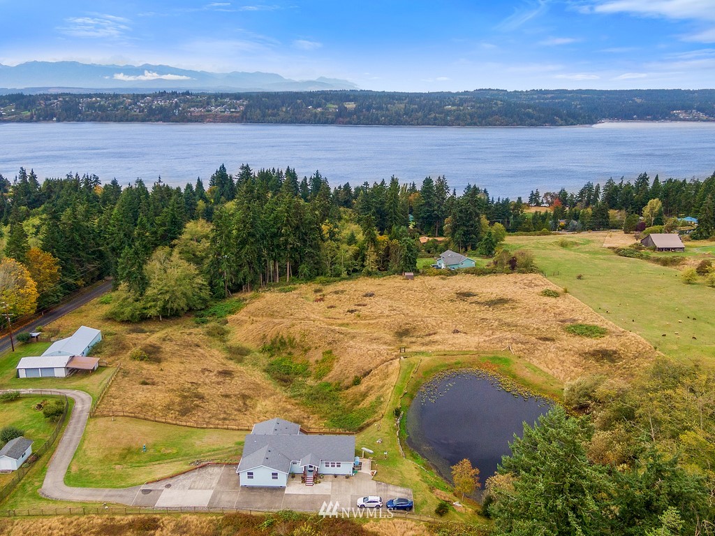 2075 East Goss Lake Road Freeland, WA 98249 - Photo 2 of 40 a view of an ocean from a yard