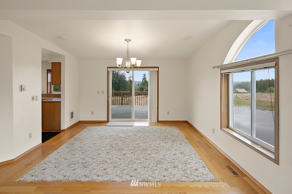 2075 East Goss Lake Road Freeland, WA 98249 - Photo 11 of 40 a view of an empty room with glass door