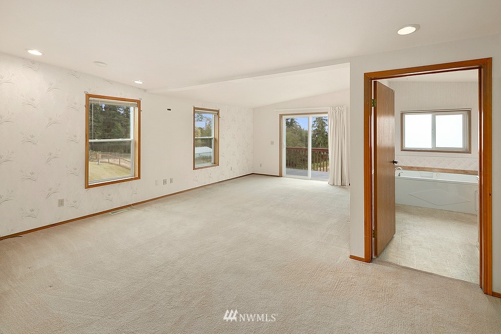 2075 East Goss Lake Road Freeland, WA 98249 - Photo 12 of 40 an empty room with windows and closet