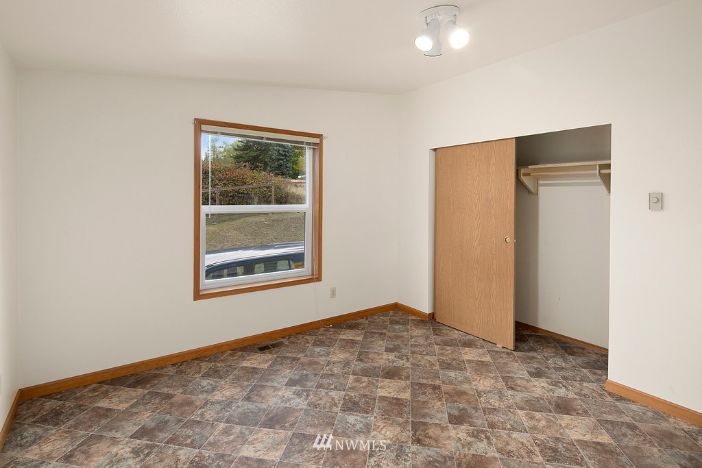 2075 East Goss Lake Road Freeland, WA 98249 - Photo 15 of 40 a view of an empty room with window and closet