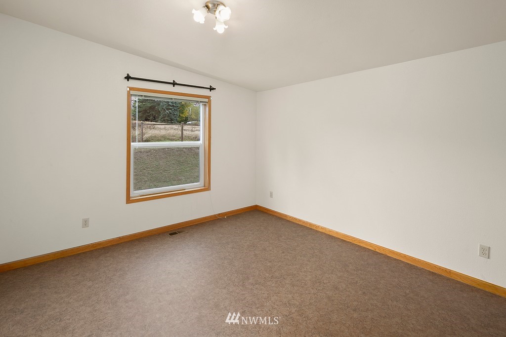 2075 East Goss Lake Road Freeland, WA 98249 - Photo 16 of 40 an empty room with a window