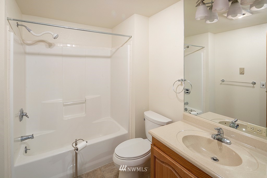 2075 East Goss Lake Road Freeland, WA 98249 - Photo 17 of 40 a bathroom with a sink toilet and shower