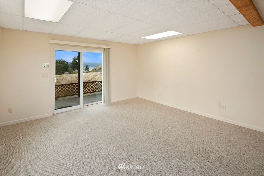 2075 East Goss Lake Road Freeland, WA 98249 - Photo 22 of 40 an empty room with a window