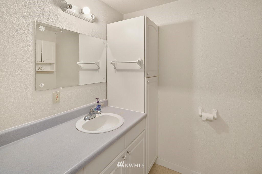 2075 East Goss Lake Road Freeland, WA 98249 - Photo 24 of 40 a bathroom with a sink and a mirror