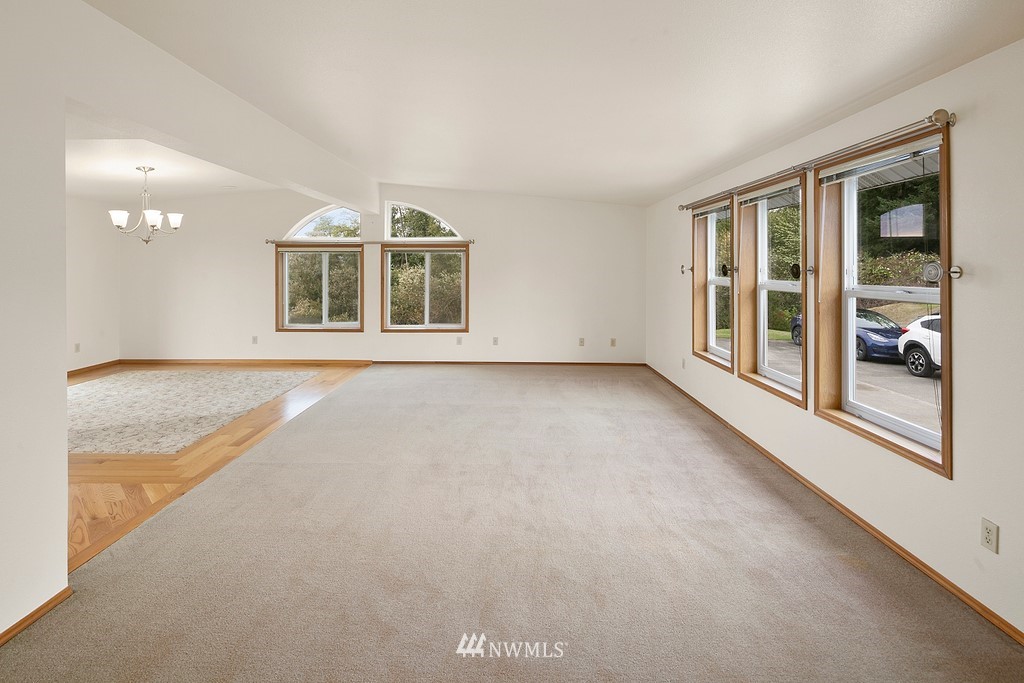 2075 East Goss Lake Road Freeland, WA 98249 - Photo 9 of 40 a view of an empty room with a window