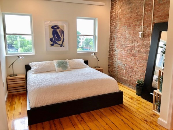 1920 Washington Street, Unit 6 Boston, MA 02118 - Photo 6 of 15 a bedroom with a bed and a window