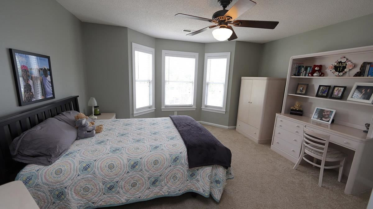 3820 Evander Way Raleigh, NC 27613 - Photo 26 of 30 This is the largest bedroom. It also has a bay window & fan. There is access to the attic via pull down stairs. Bedroom