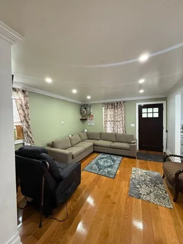 a living room with furniture window and a table