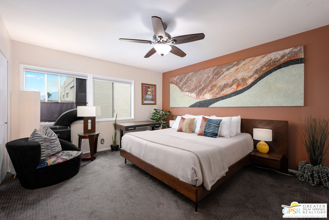 277 East Alejo Road, Unit 124 Palm Springs, CA 92262 - Photo 14 of 25 a bedroom with a bed couch and window