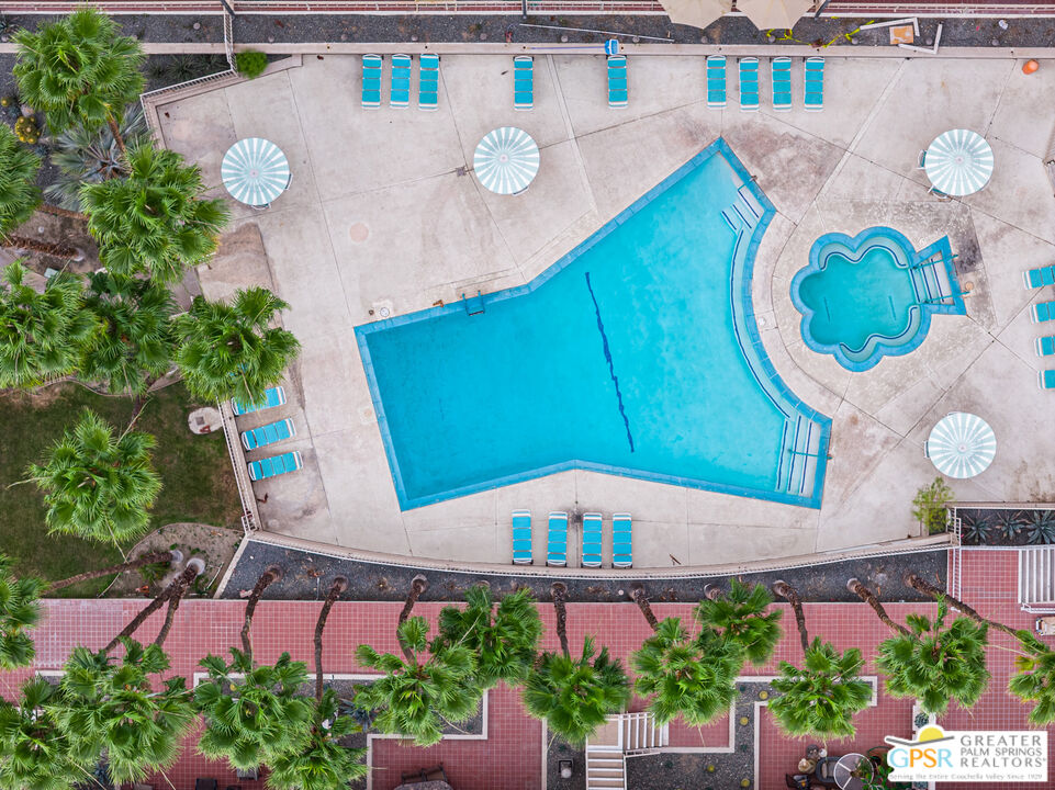 277 East Alejo Road, Unit 124 Palm Springs, CA 92262 - Photo 20 of 25 an aerial view of a house with garden space and swimming pool