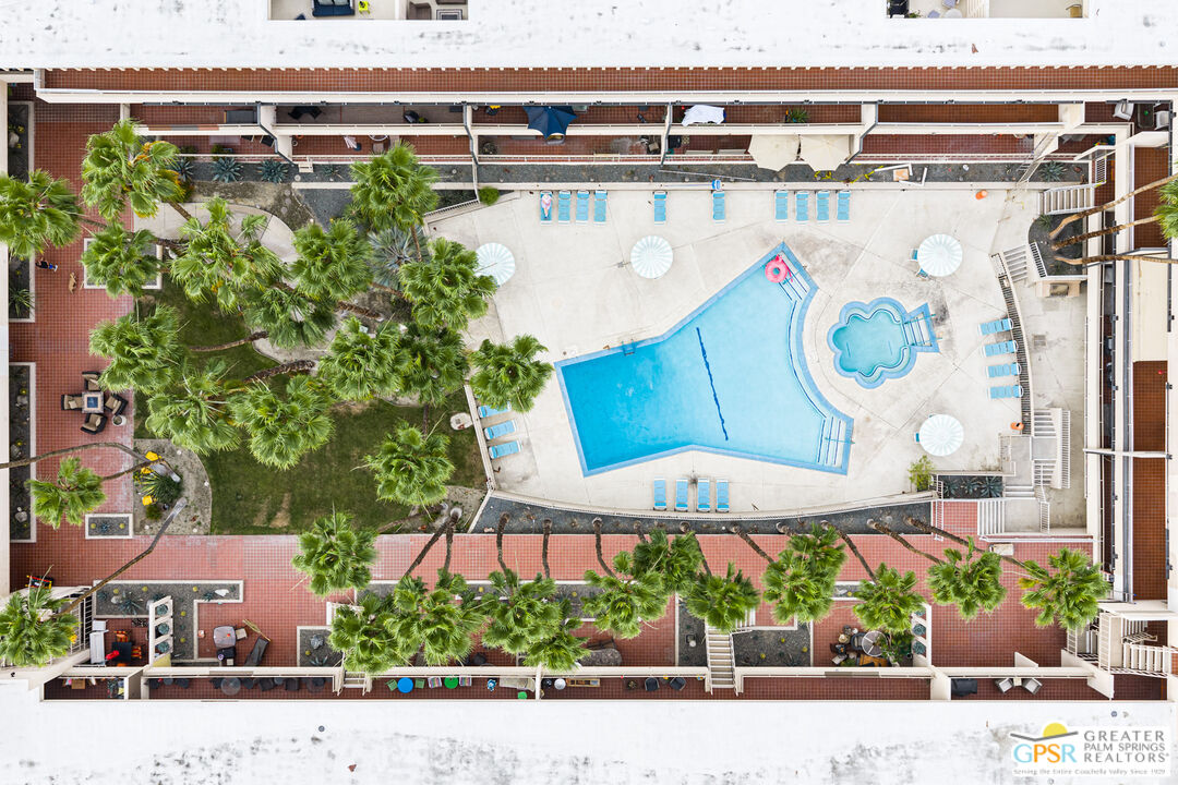 277 East Alejo Road, Unit 124 Palm Springs, CA 92262 - Photo 2 of 25 an aerial view of a house with a yard and a garden