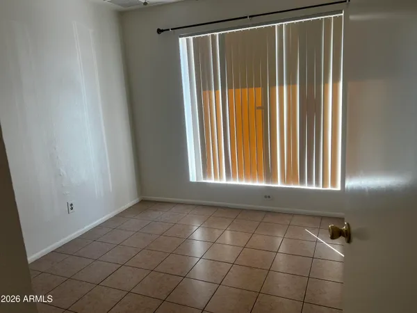 a view of an empty room with windows