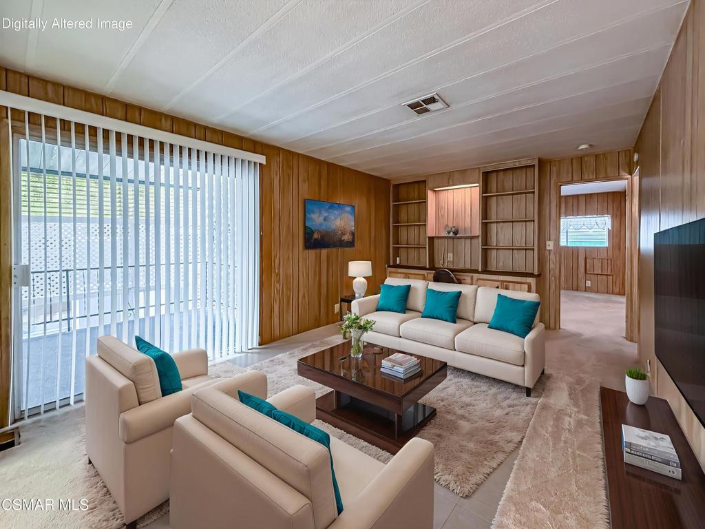 195 Tierra Rejada Road, Unit 116 Simi Valley, CA 93065 - Photo 12 of 36 a living room with furniture and a large window