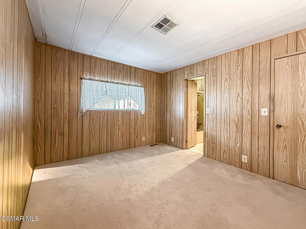 195 Tierra Rejada Road, Unit 116 Simi Valley, CA 93065 - Photo 13 of 36 an empty room with windows