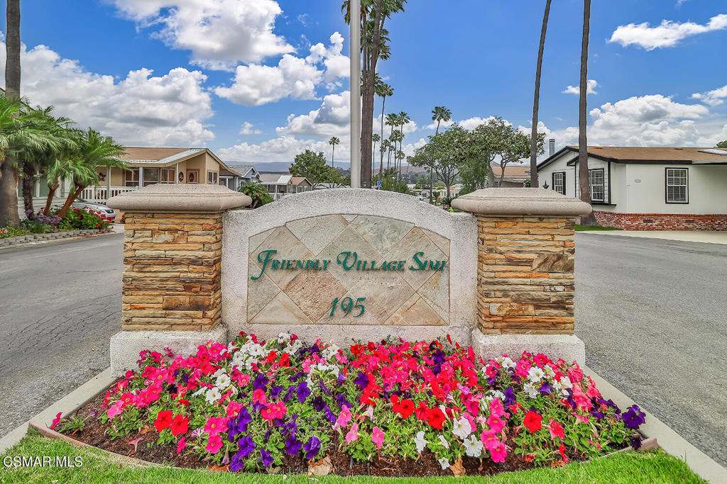 195 Tierra Rejada Road, Unit 116 Simi Valley, CA 93065 - Photo 35 of 36 a front view of a house with lots of flowers