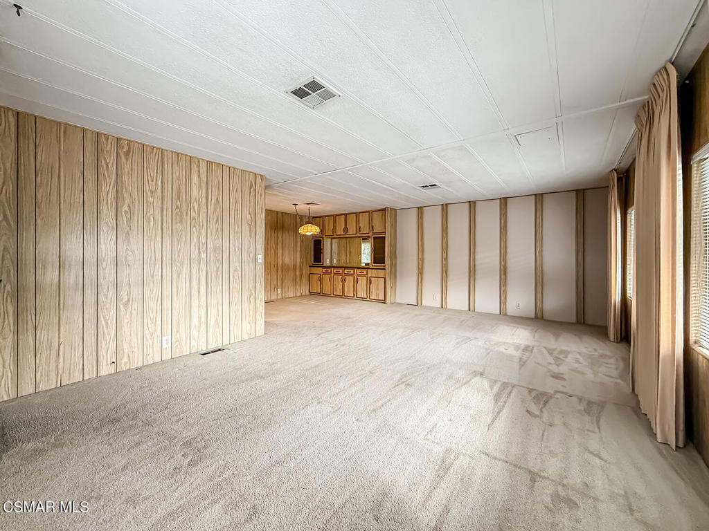 195 Tierra Rejada Road, Unit 116 Simi Valley, CA 93065 - Photo 4 of 36 a view of an empty room with a window