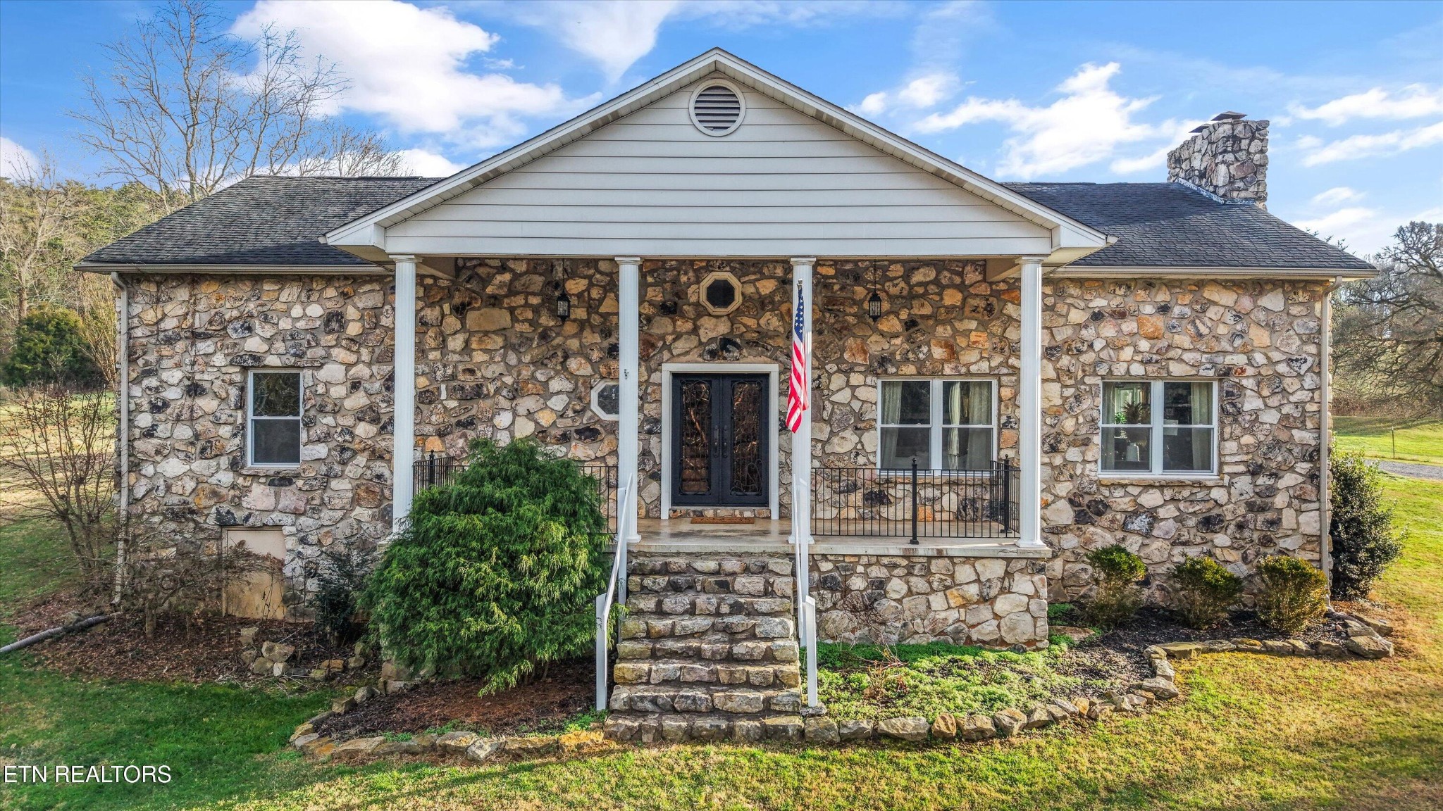 7969 Glendale Community Road Greenback, TN 37742 - Photo 1 of 56 a front view of a house with garden