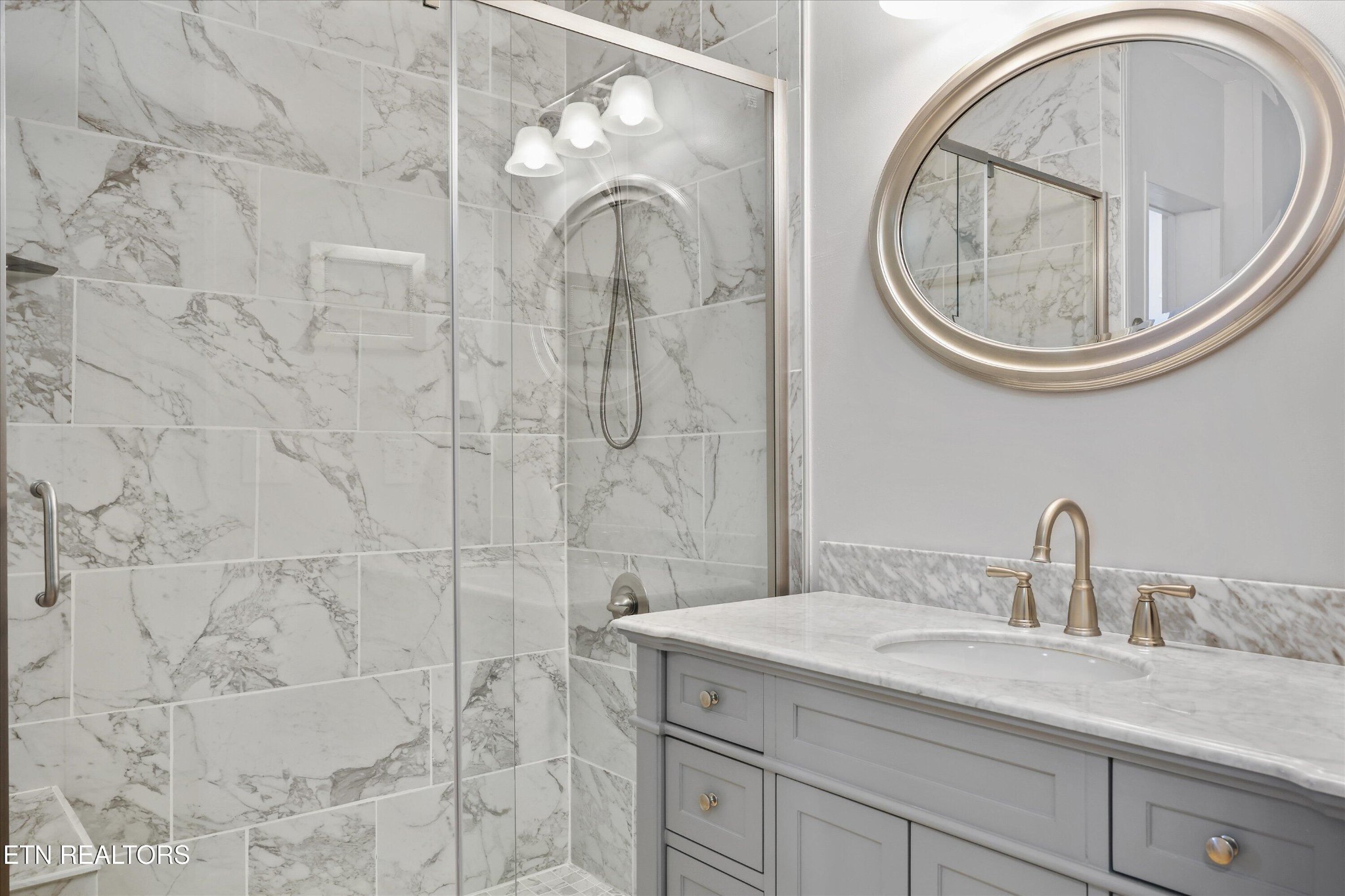 7969 Glendale Community Road Greenback, TN 37742 - Photo 28 of 56 a bathroom with a sink and a mirror