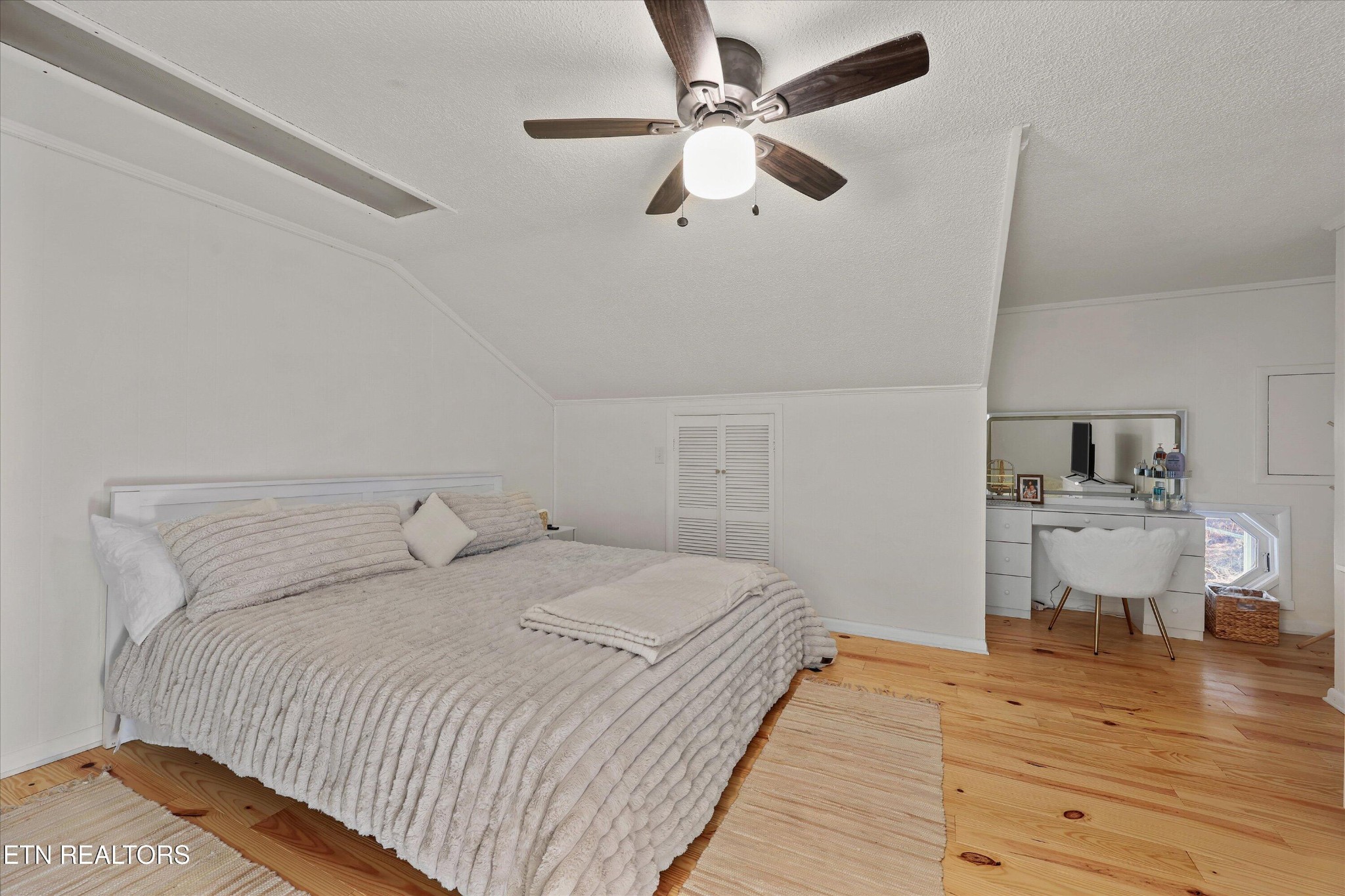 7969 Glendale Community Road Greenback, TN 37742 - Photo 36 of 56 a bedroom with a bed and wooden floor