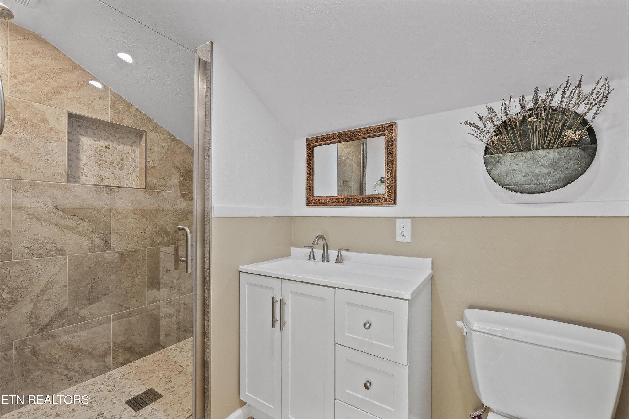 7969 Glendale Community Road Greenback, TN 37742 - Photo 37 of 56 a bathroom with a sink a toilet and a mirror
