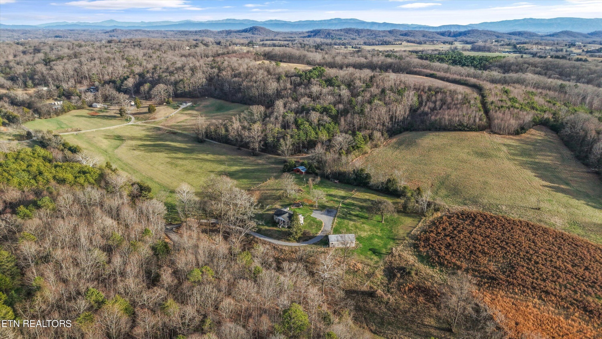 7969 Glendale Community Road Greenback, TN 37742 - Photo 52 of 56 a view of a lake with mountains in the background