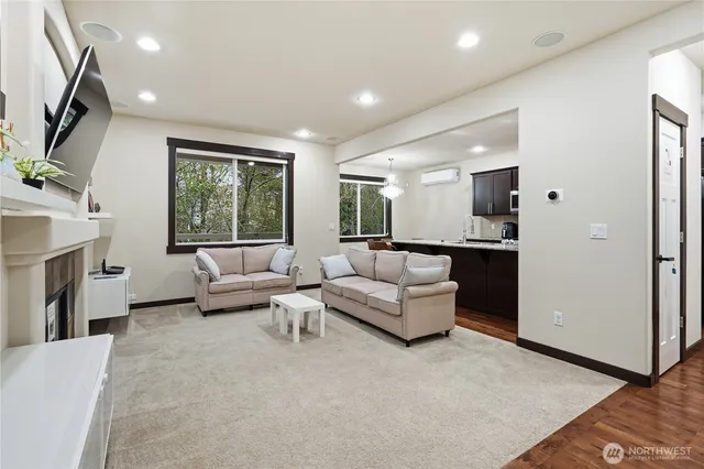 a living room with furniture and a large window