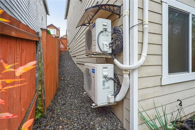 a wooden bench sitting in front of a building