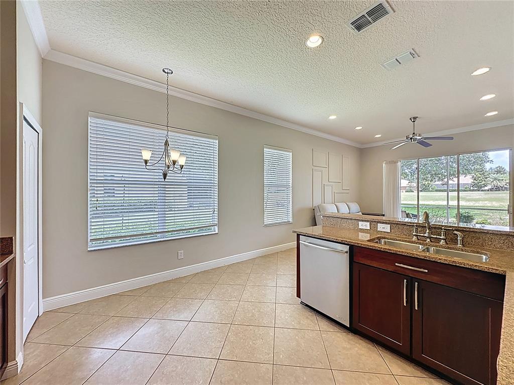 243 Bayou Bend Road Groveland, FL 34736 - Photo 21 of 77 a kitchen with a sink and a window
