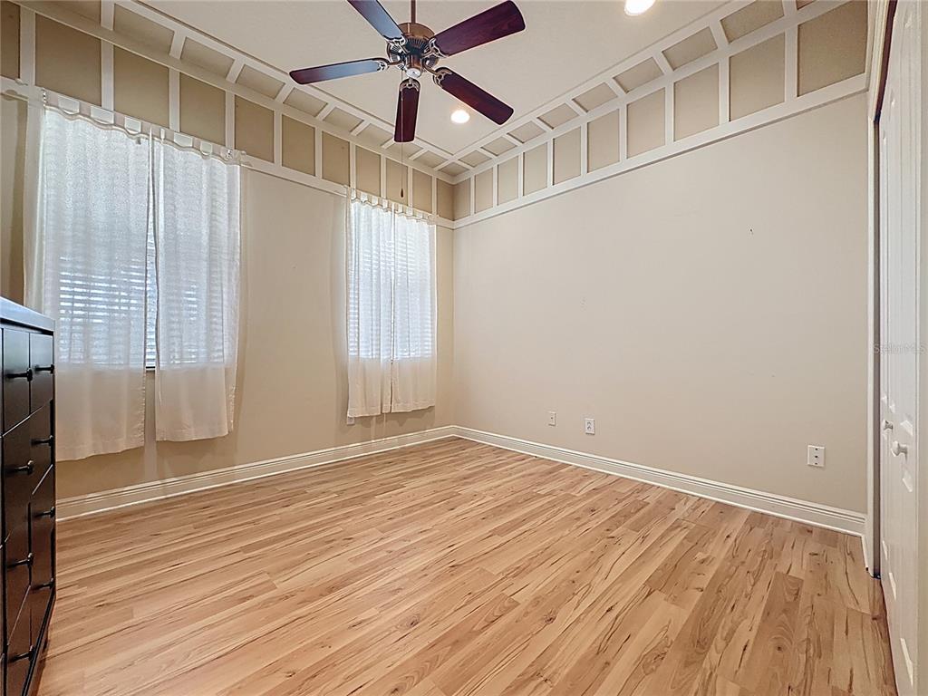 243 Bayou Bend Road Groveland, FL 34736 - Photo 38 of 77 an empty room with wooden floor closet and windows