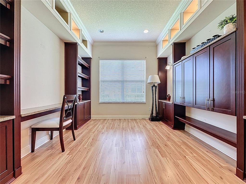 243 Bayou Bend Road Groveland, FL 34736 - Photo 41 of 77 a view of a room with furniture and wooden floor