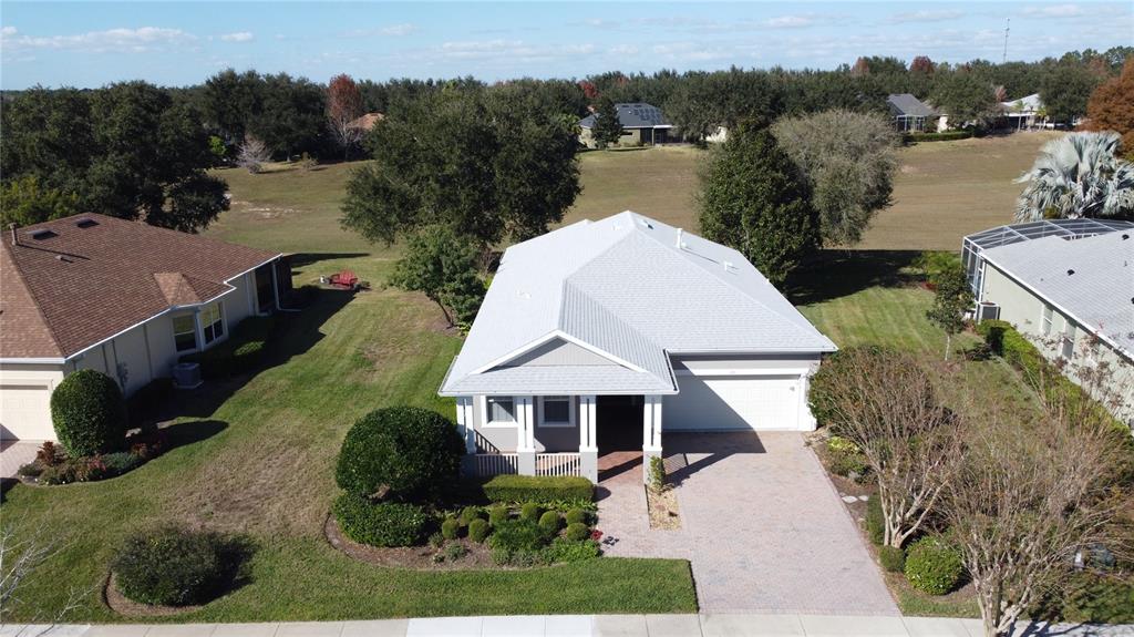 243 Bayou Bend Road Groveland, FL 34736 - Photo 50 of 77 an aerial view of a house with a yard and lake view