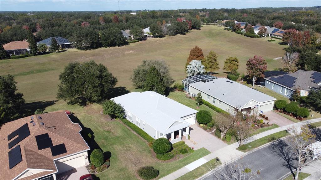 243 Bayou Bend Road Groveland, FL 34736 - Photo 53 of 77 an aerial view of multiple houses with yard