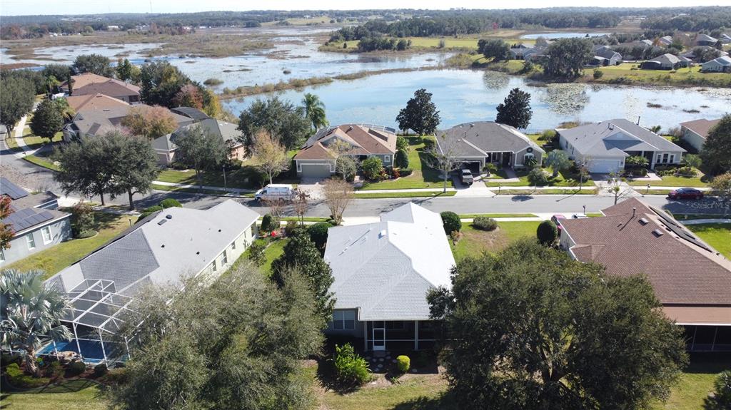 243 Bayou Bend Road Groveland, FL 34736 - Photo 56 of 77 an aerial view of a house with yard swimming pool and ocean view