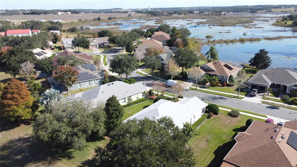 243 Bayou Bend Road Groveland, FL 34736 - Photo 57 of 77 an aerial view of a houses with a swimming pool