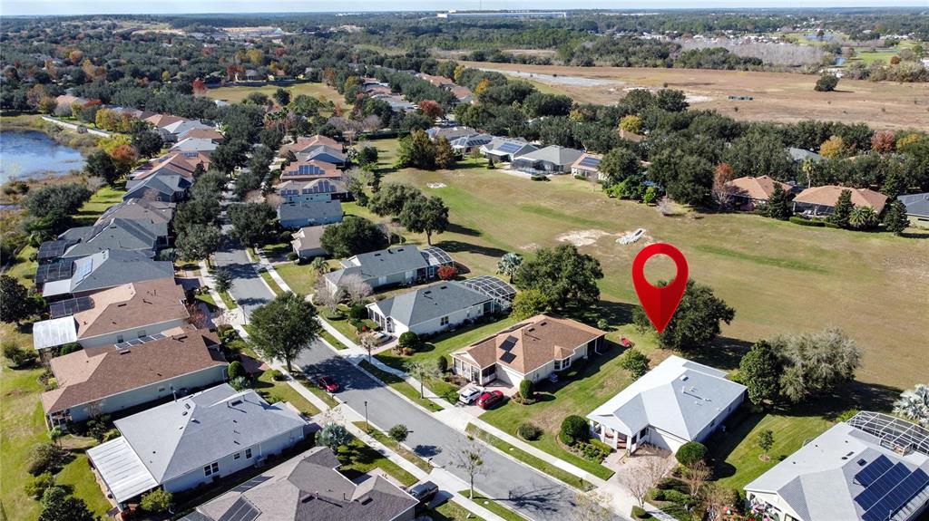 243 Bayou Bend Road Groveland, FL 34736 - Photo 60 of 77 an aerial view of a houses with a lake view