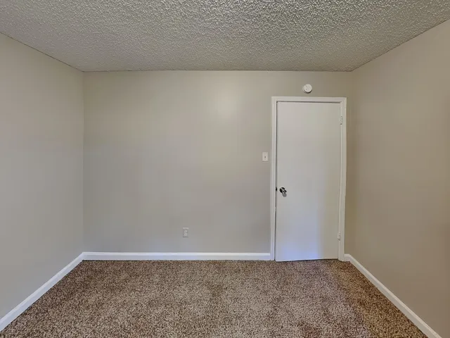 a en suite bathroom with a sink and mirror