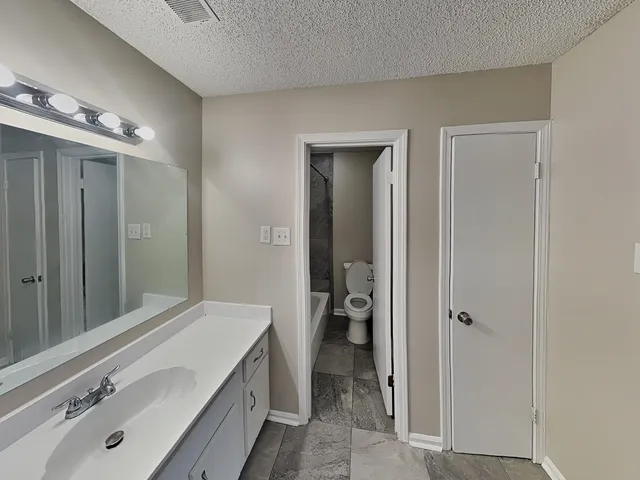 an empty room with closet area