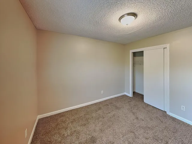 an empty room with a empty space and window