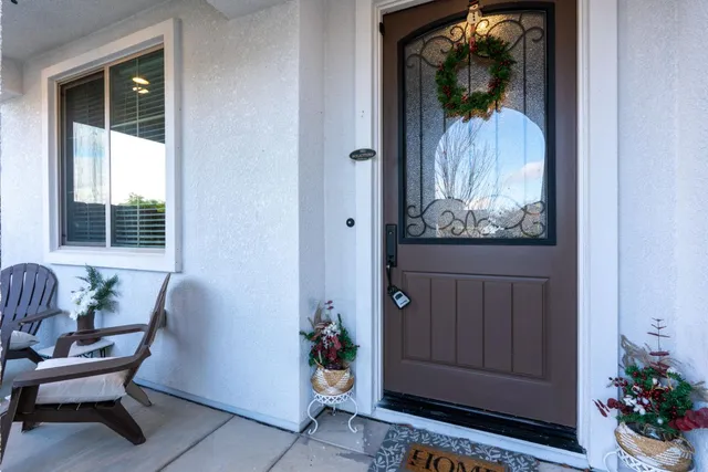 a bedroom with furniture and a flat screen tv