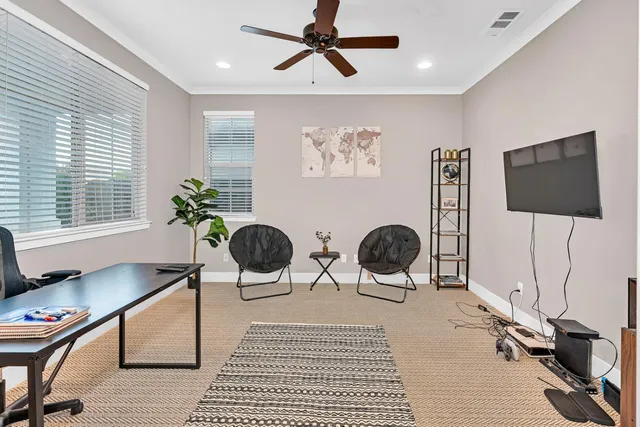 a living room with furniture fireplace and flat screen tv