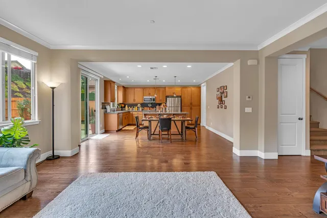 a kitchen with stainless steel appliances granite countertop a sink and a refrigerator