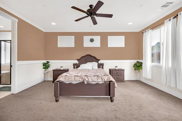 an aerial view of residential houses with outdoor space and parking