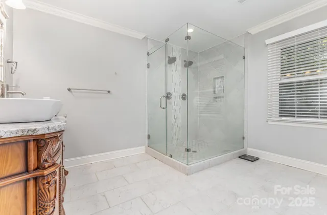 a bathroom with a shower and a sink