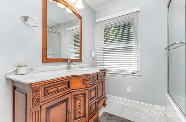 a bathroom with a sink a mirror and a bathtub