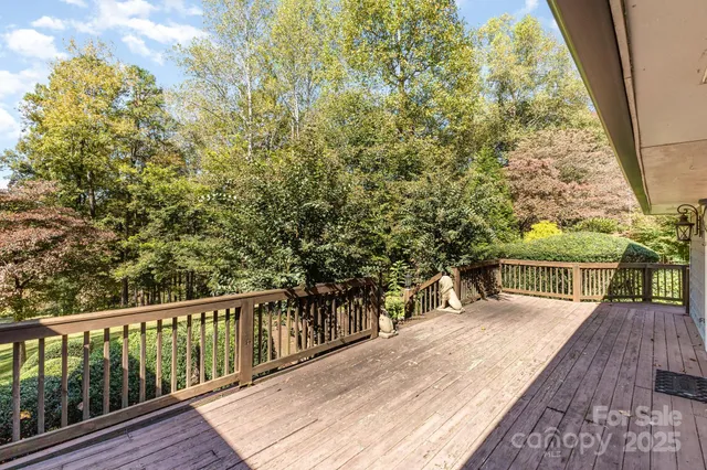 a view of a balcony with wooden floor