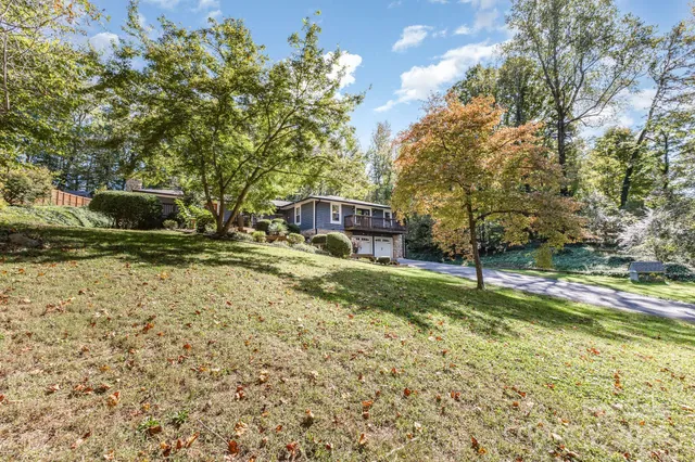 a view of swimming pool with a yard