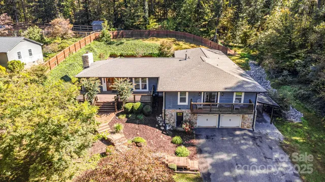 aerial view of a house with swimming pool and sitting area