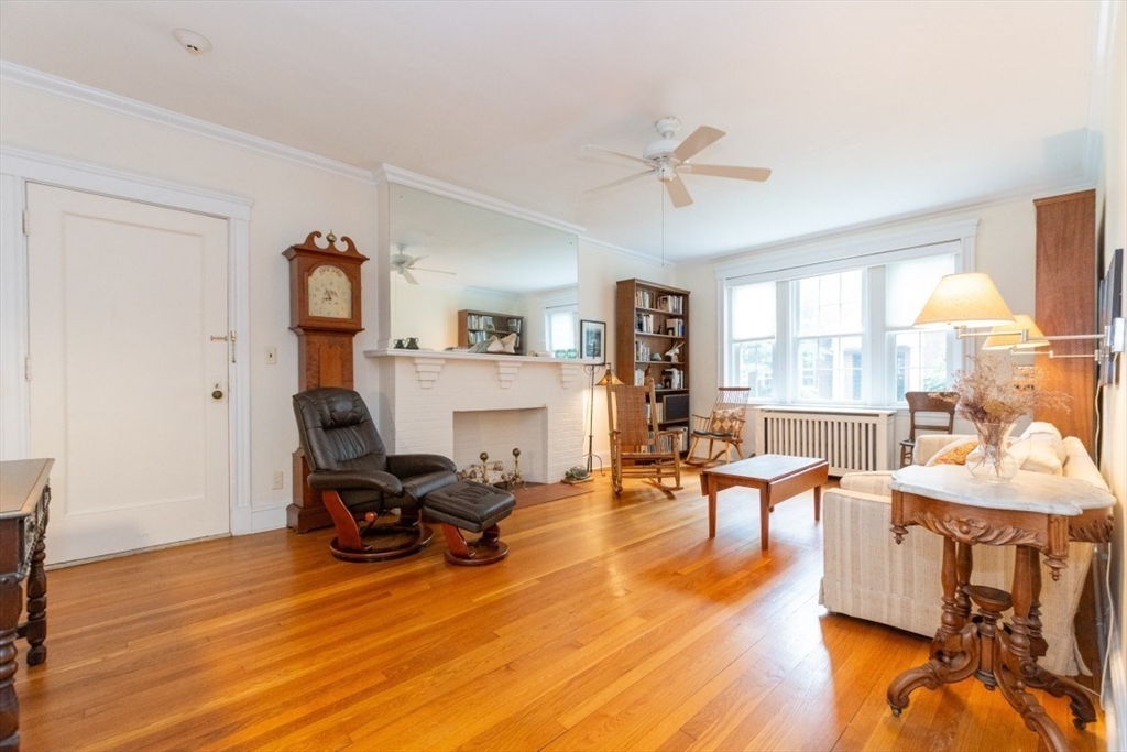 63 Babcock Street, Unit B1 Brookline, MA 02446 - Photo 5 of 32 a living room with furniture and a wooden floor