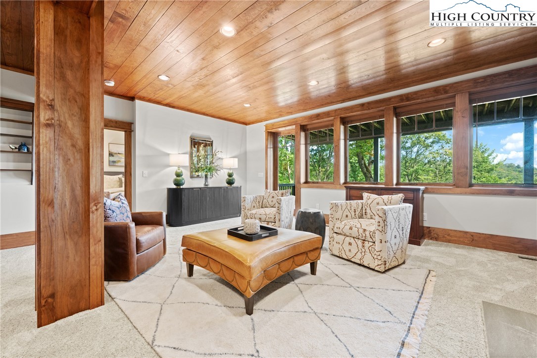 299 Edgewood Path Blowing Rock, NC 28605 - Photo 15 of 39 a living room with furniture and large windows