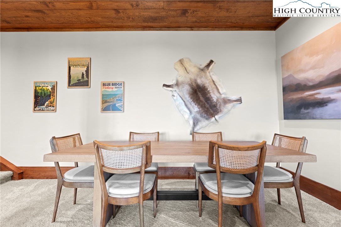 299 Edgewood Path Blowing Rock, NC 28605 - Photo 16 of 39 a dining room with furniture and window